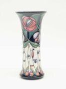 A modern Moorcroft vase with a Mackintosh design of flowers on a blue ground (factory second),