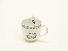 A Hughes moulded coffee cup with Chinoiserie design below and key and sell border, circa 1764
