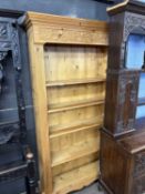 Modern pine bookcase with acorn carved decoration, 203cm high
