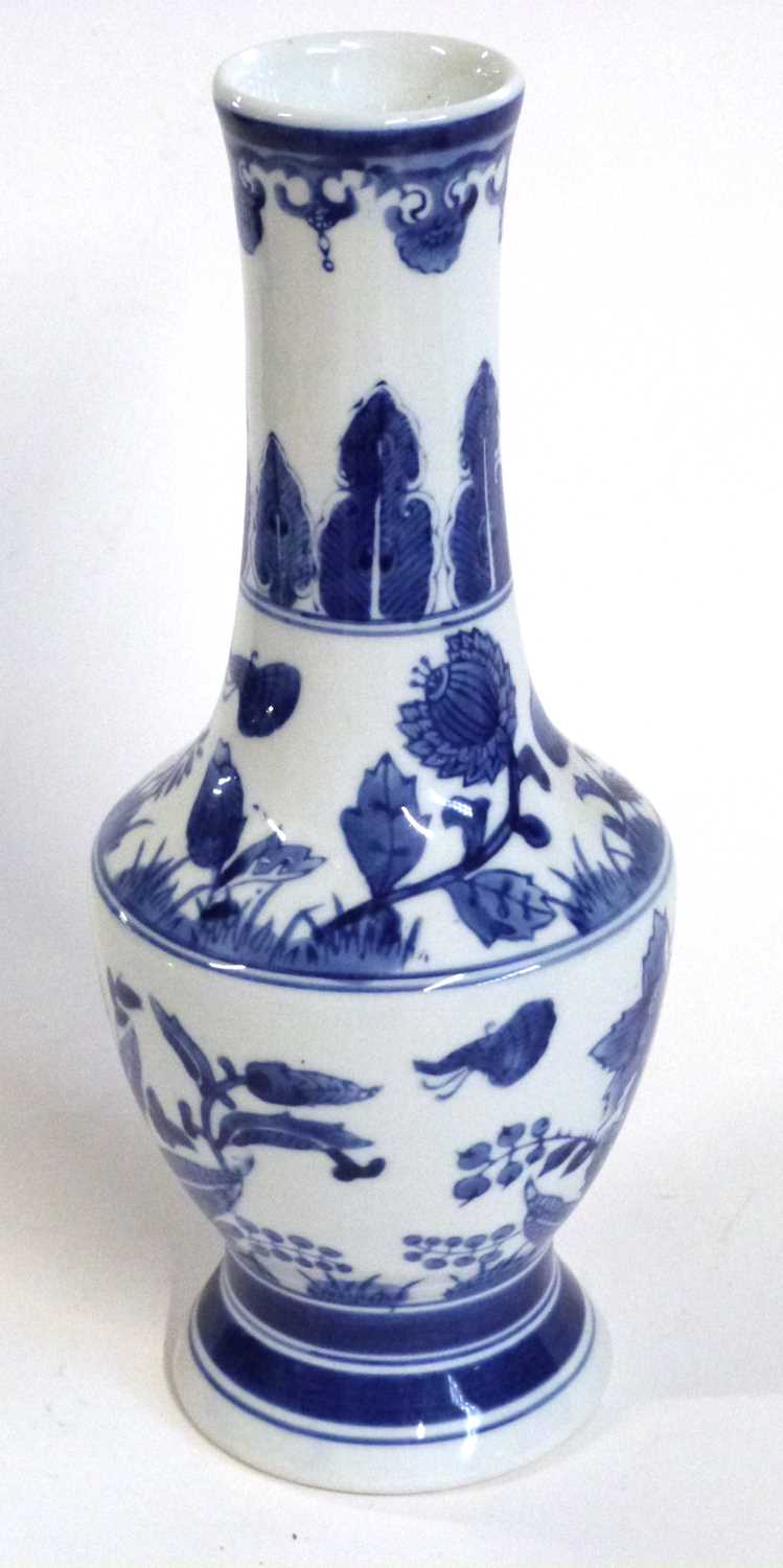 A Chinese porcelain vase, 20th Century with a painted blue and white floral design, 32cm high - Image 4 of 9