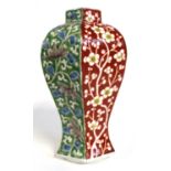 A Chinese porcelain jar of baluster faceted shape with Famille Rose/Vert decoration, 17cm high