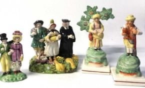A group of early/mid 19th Century Staffordshire figures including a Staffordshire Tithe Pig group