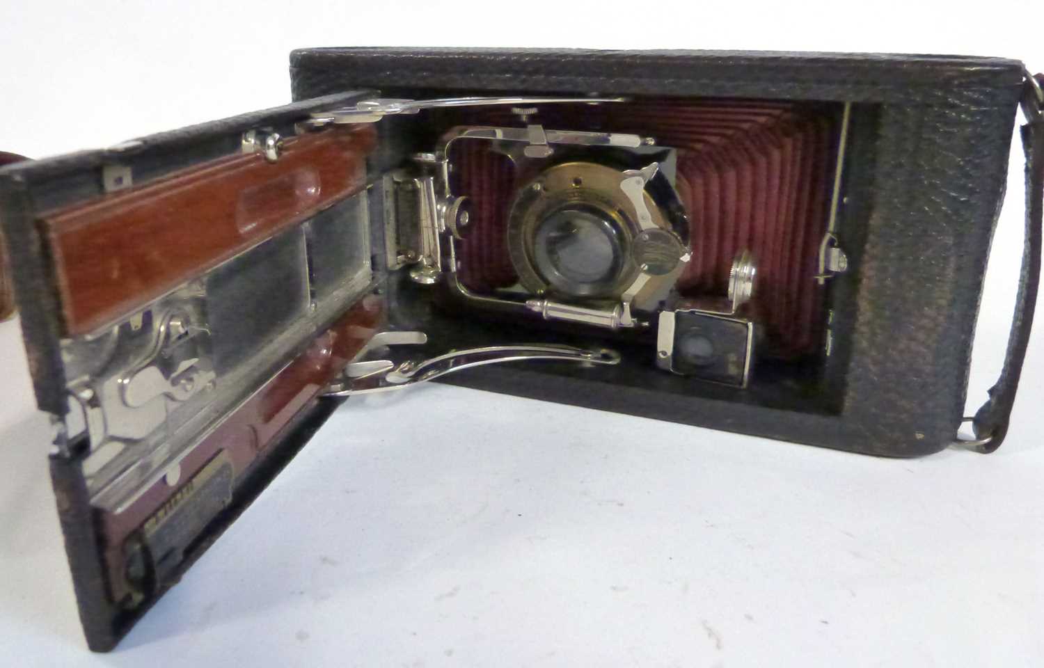 A vintage Kodak camera entitled The Carbine in original leather case
