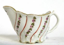 Lowestoft cream jug in Low Chelsea ewer form decorated with floral sprays