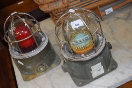 Two vintage ships lights with metal outer cages, 25cm high