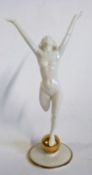 A Hutschenreuther model of The Sun Child modelled as a naked lady standing on a globe, modelled by