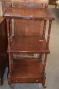 Victorian mahogany what-not of typical form with turned column supports and base drawer, raised on