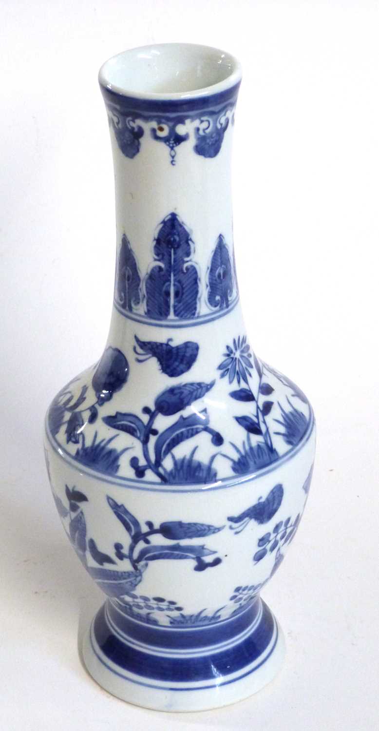 A Chinese porcelain vase, 20th Century with a painted blue and white floral design, 32cm high - Image 3 of 9