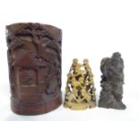 A carved bamboo Chinese brush washer together with a soap stone carving of monkeys and further