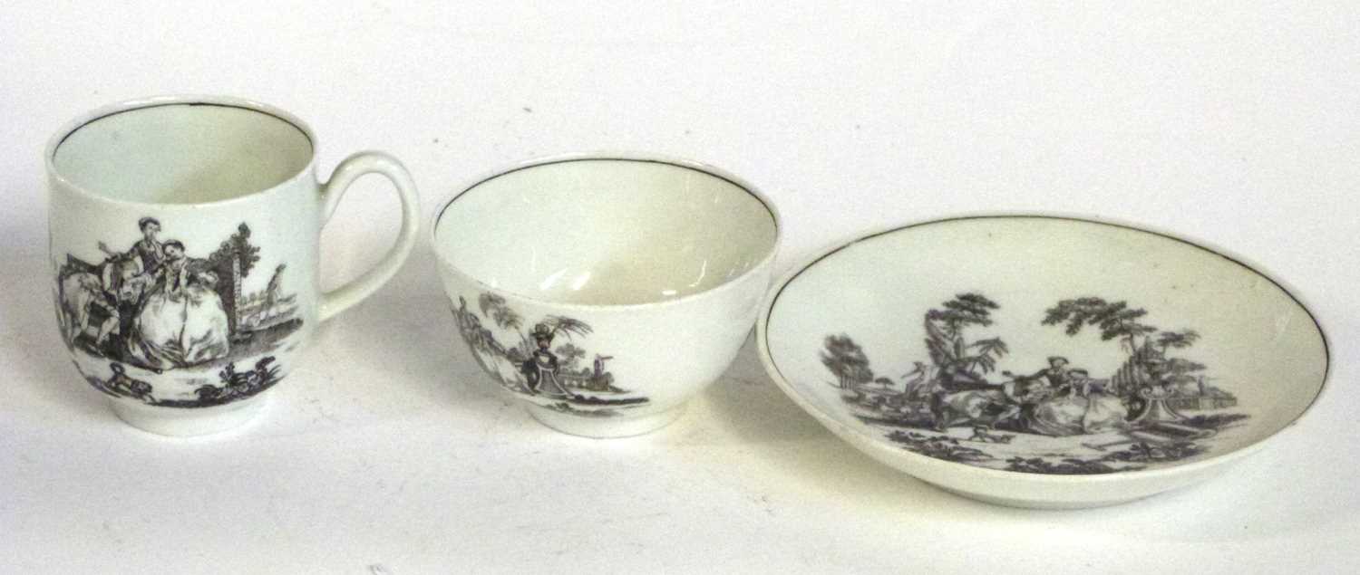 A Worcester tea bowl and saucer with matching cup, all printed with the L'amore print