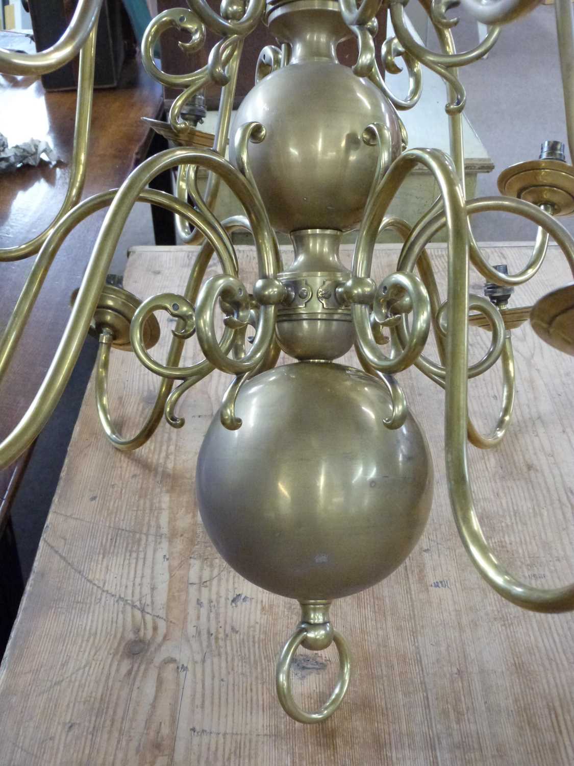 A large reproduction Dutch style brass light fitting, fitted with twelve scrolled arms, approx - Image 3 of 5