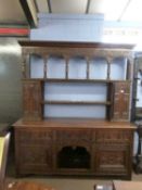 Large Victorian gothic revival heavily carved oak dresser with two shelf back, two small integral
