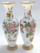 A pair of late 19th Century milk glass vases, painted with roses, 35cm high