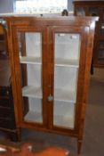 A 20th Century mahogany and inlaid two door display cabinet on tapering legs, 90cm wide