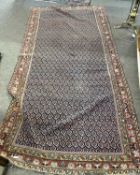 Persian rug with central leaf design panel in faded blue/red/cream 275cm x 150 cm