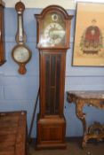 A 20th Century oak cased grandmother clock with a brass triple weight movement playing Westminster