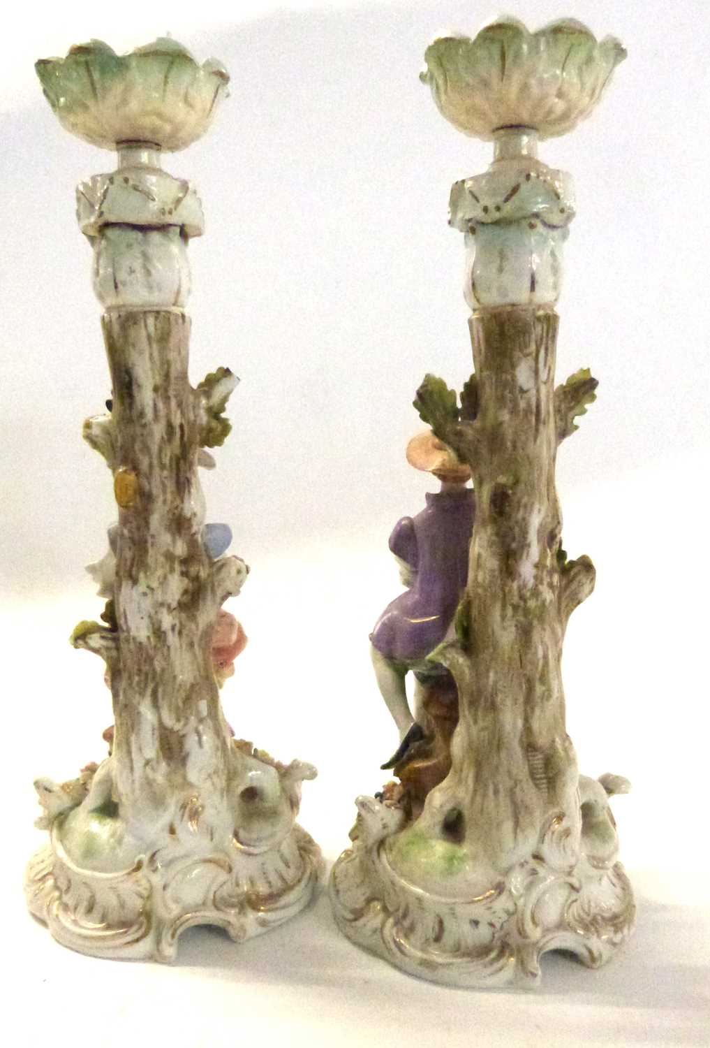 A pair of continental porcelain candlesticks, possibly Sitzendorf, modelled as a boy and girl - Image 2 of 6