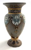 A Doulton Lambeth silicon ware vase, the grey body with geometric design in gilt and blue by Eliza
