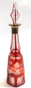 A Bohemian style decanter, the amber glass with a fruiting vine design with silver collar and