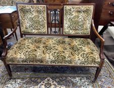 An Edwardian mahogany framed cottage sofa with floral upholstery, 116cm wide