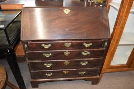 A Georgian mahogany bureau with fitted interior over four long drawers and bracket feet, 90cm wide