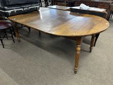 Oak and elm circular dining table raised on two tapering legs together with two accompanying