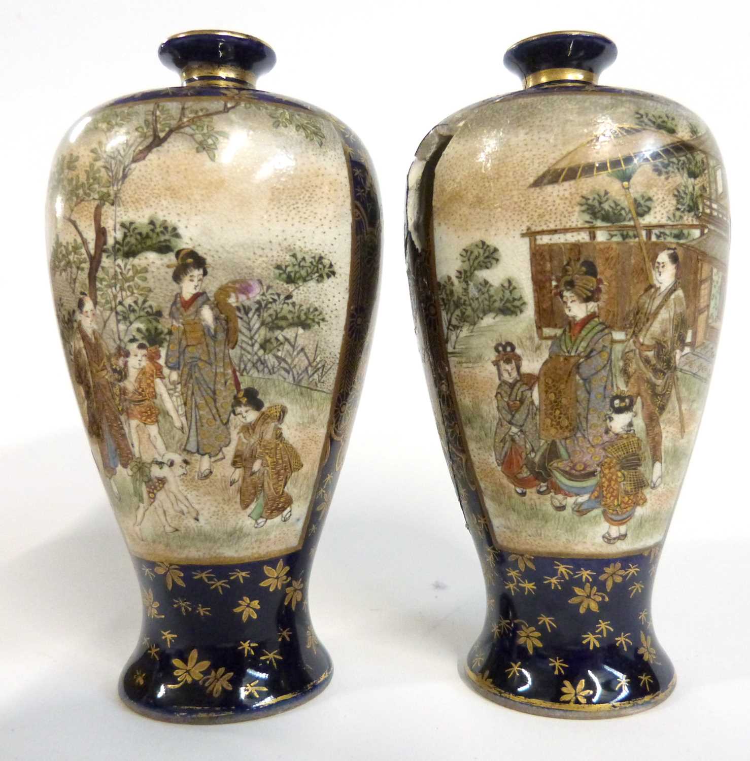 Wooden box containing two Japanese porcelain Satsuma ware vases with panels decorated in gilt in