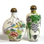Two Chinese enamel scent bottles with covers, one with painted decoration of flowers and fruit,