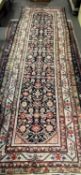 Persian wool runner carpet with central leaf design 108 x 375cm