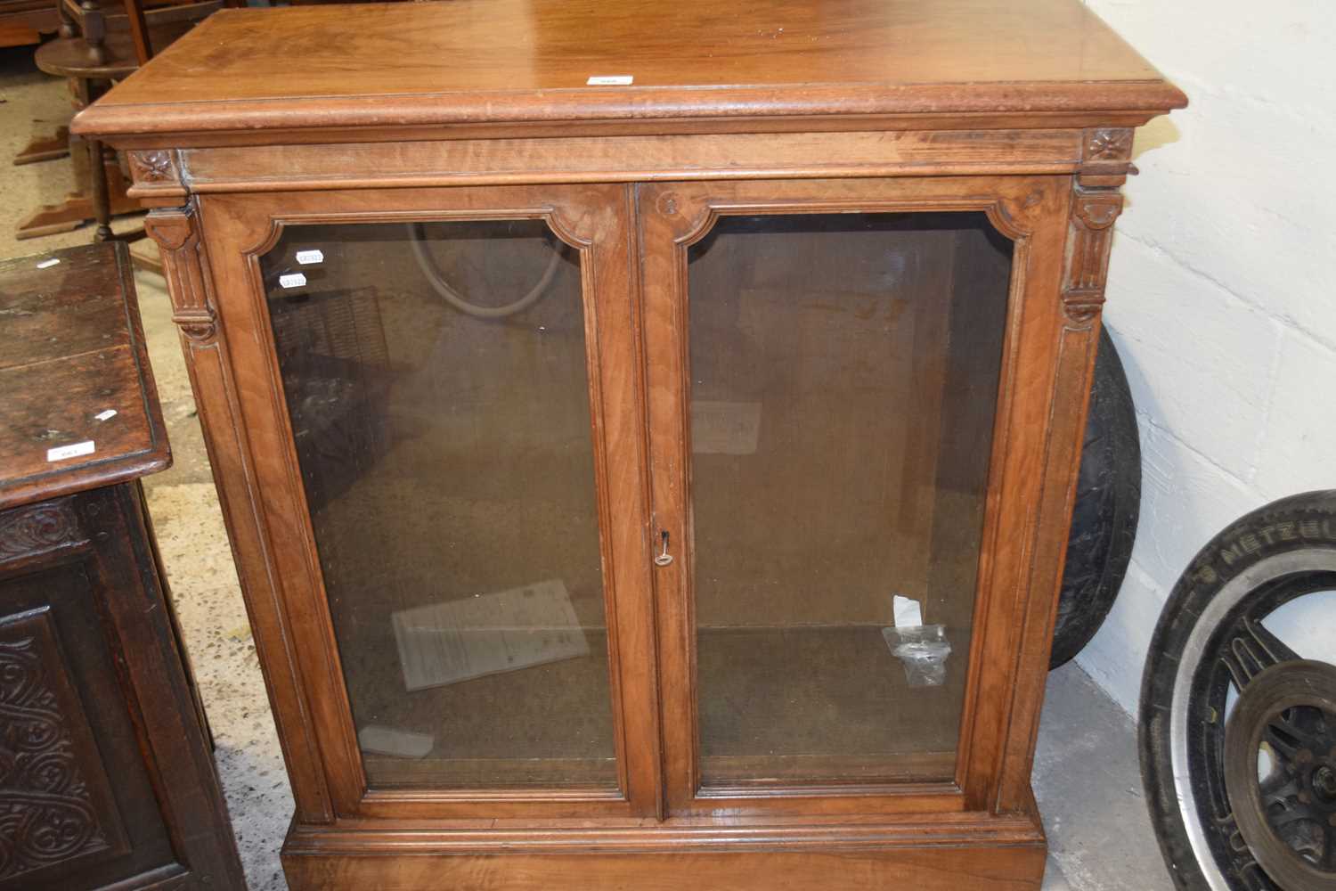 Victorian faded walnut veneered two door bookcase cabinet on plinth base,98cm wide