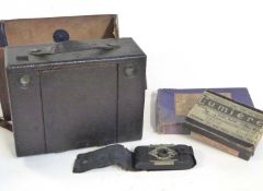 An Eastman Kodak Bellows camera in original leather case, the mahogany interior with brass mounts,