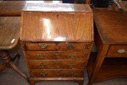 A small Queen Anne and later walnut ladies bureau with fall flap, fitted interior over two short and