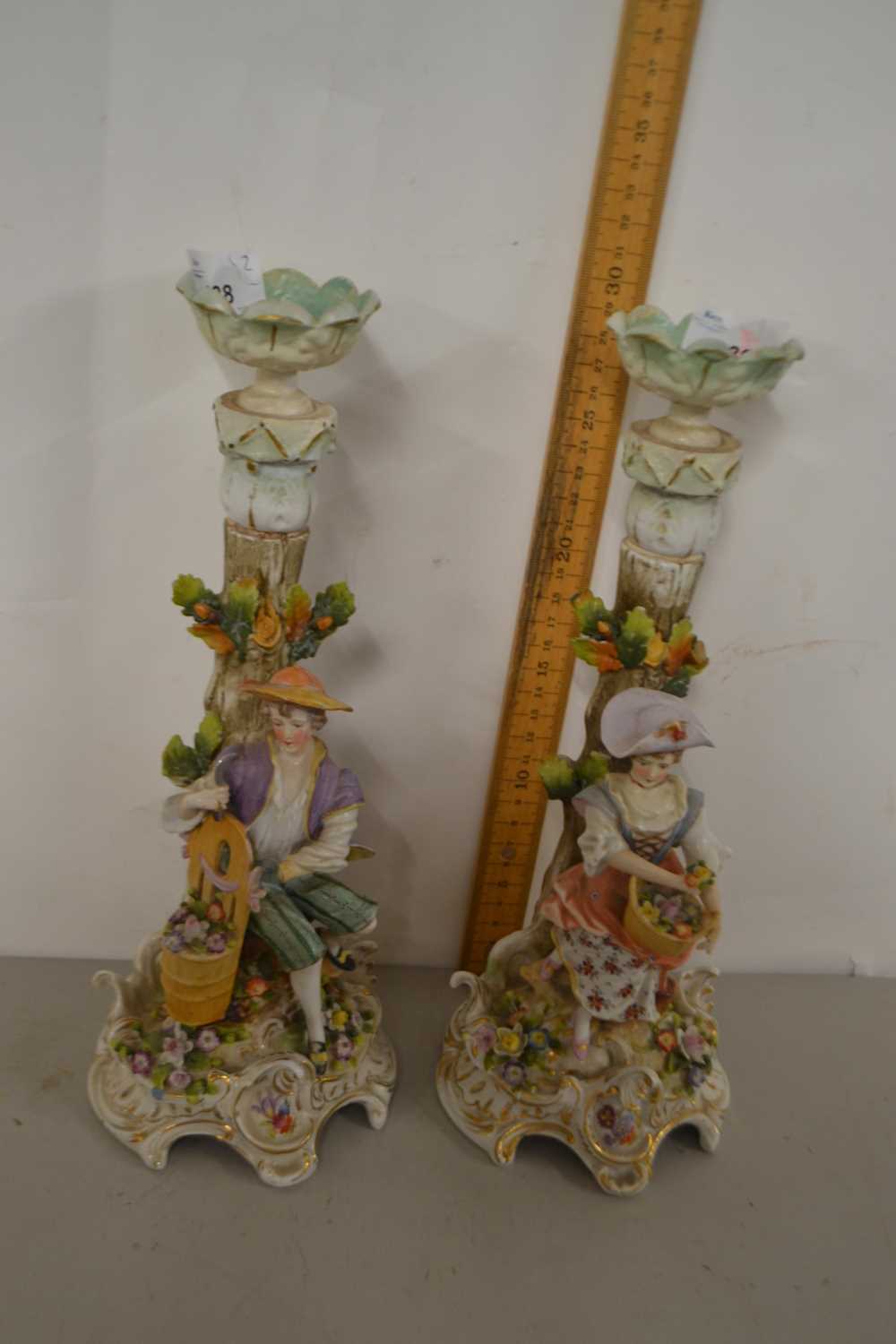 A pair of continental porcelain candlesticks, possibly Sitzendorf, modelled as a boy and girl - Image 4 of 6