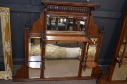 Small late Victorian American walnut over mantel mirror with six panels of bevelled glass, 90cm