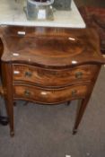 A small Edwardian mahogany serpentine front two drawer side cabinet, 59cm wide