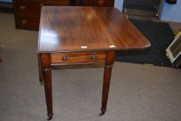 A 19th century mahogany Pembroke table on fluted legs