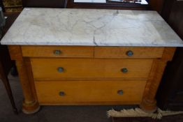 A 19th Century marble top chest of four drawers, the body partly veneered with birds eye maple and