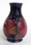 A Moorcroft vase of baluster shape decorated with pomegranate pattern with one open pomegranate,