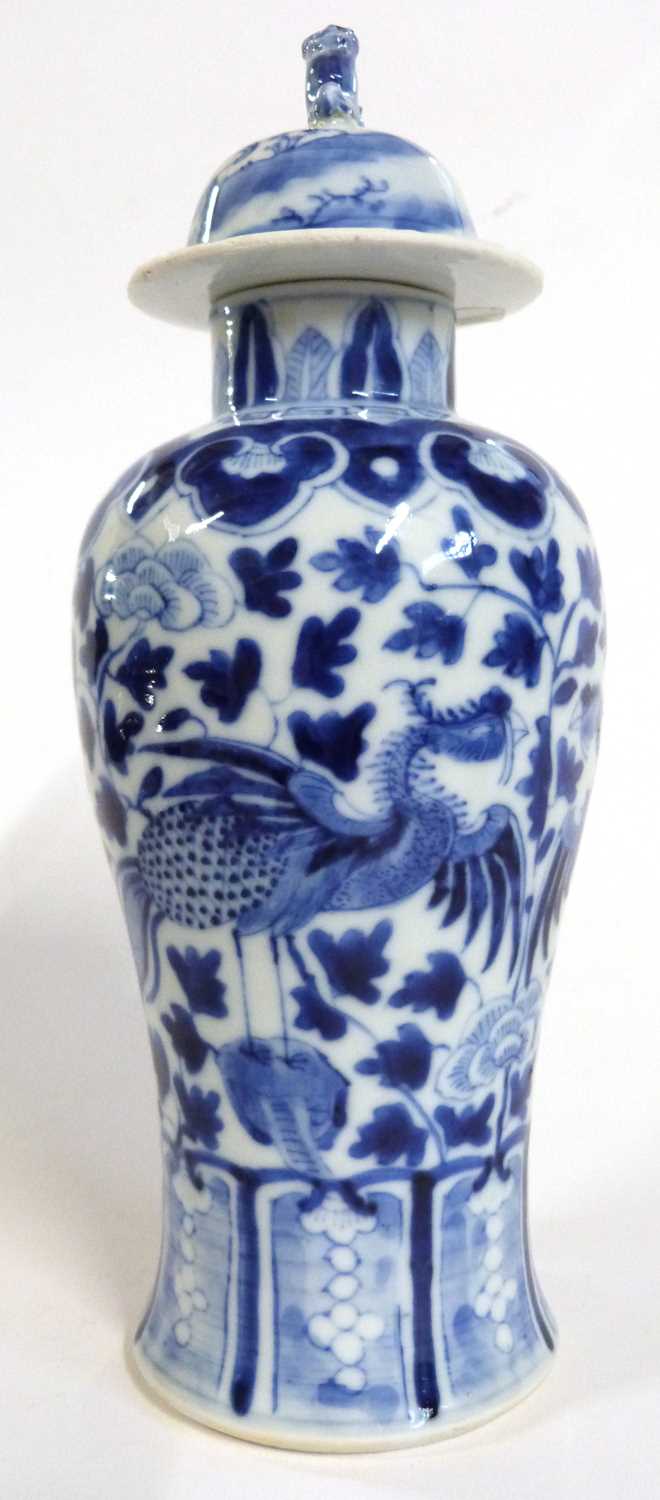 Chinese porcelain vase with blue an white decoration of a phoenix amongst flowers, four character