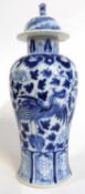 Chinese porcelain vase with blue an white decoration of a phoenix amongst flowers, four character