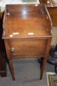 Victorian mahogany single door pot cupboard with galleried top and turned legs, 80cm high