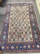 Persian wool rug with multi star design to central panel 140 x 225 cm