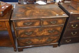 A 18th Century and later chest with two short and two long drawers, finished with walnut and cross