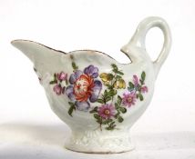 A Lowestoft porcelain dolphin shaped ewer with polychrome decoration of flowers, circa 1775