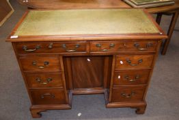 Arthur Brett of Norwich - A reproduction mahogany veneered knee hole desk with green leather writing