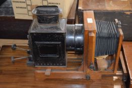 A vintage Magic Lantern projector with bellows action to front, approx 45cm long