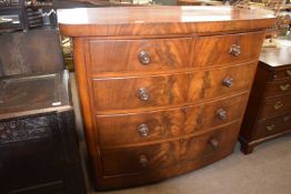 A Victorian mahogany bow front chest of five drawers with turned knob handles, 122cm wide