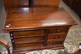 A reproduction mahogany television cabinet with drawers, 104cm wide