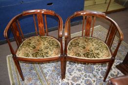 A pair of Edwardian mahogany and inlaid bow back armchairs, 75cm high