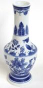 A Chinese porcelain vase, 20th Century with a painted blue and white floral design, 32cm high